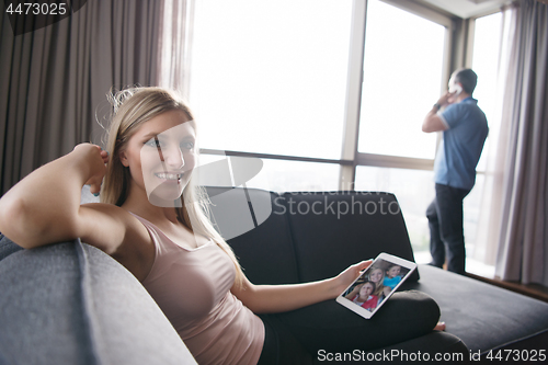 Image of woman using tablet in beautiful apartment