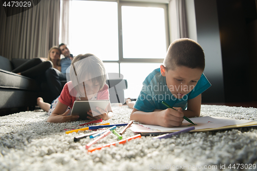 Image of young couple spending time with kids