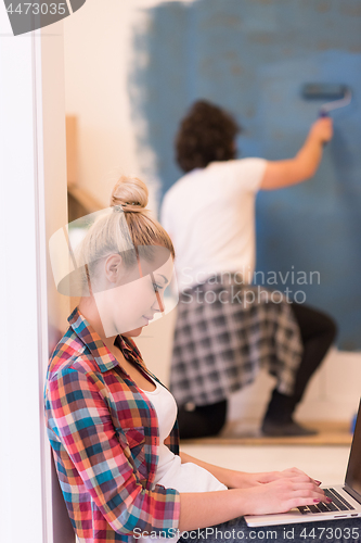 Image of Happy couple doing home renovations