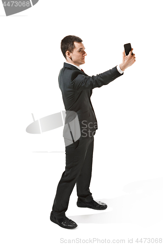 Image of Happy businessman talking on the phone isolated over white background in studio shooting