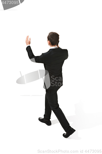 Image of The back of businessman over white background