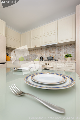 Image of Modern beige colored kitchen and dining room