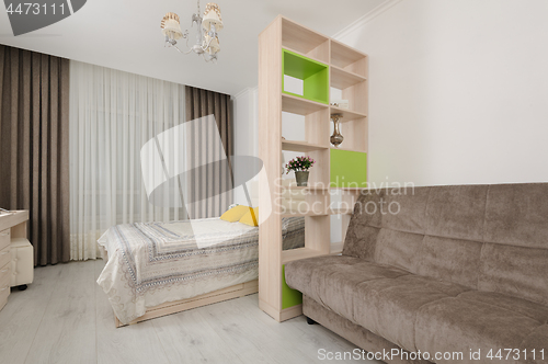 Image of Bedroom interior with bookshelf