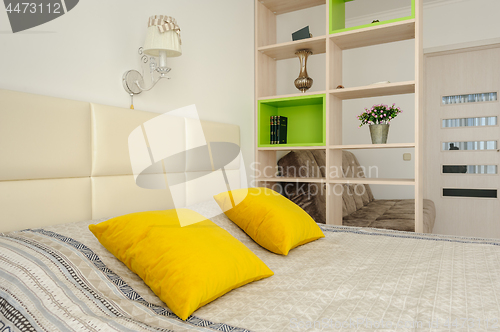 Image of Bedroom interior with bookshelf