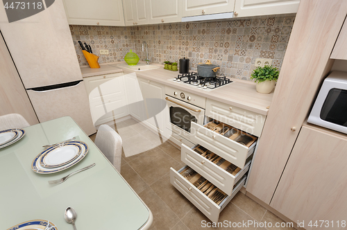 Image of Modern beige colored kitchen and dining room