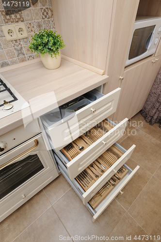 Image of Modern beige colored kitchen