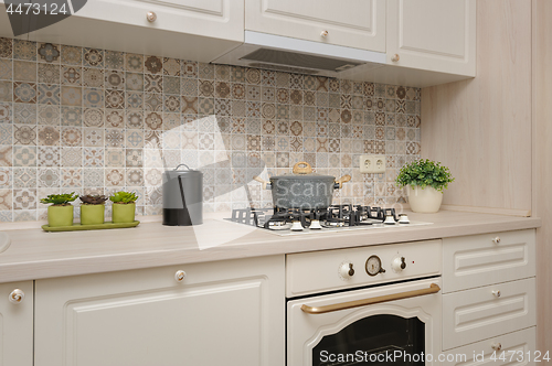 Image of Modern beige colored kitchen and dining room