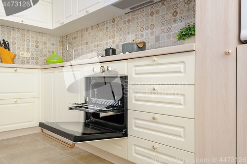 Image of Modern beige colored kitchen and dining room