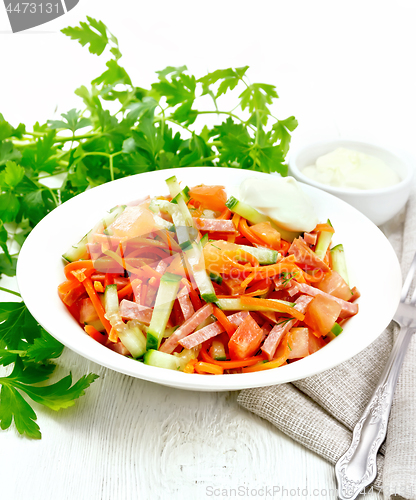 Image of Salad of sausage and spicy carrots on table