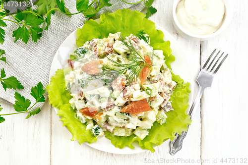 Image of Salad of salmon and avocado with mayonnaise on board top