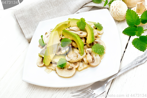 Image of Salad of avocado and champignons on light board