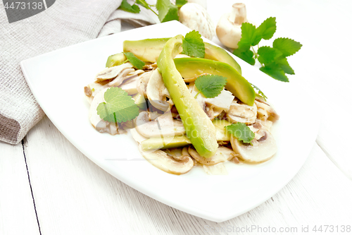 Image of Salad of avocado and champignons on board