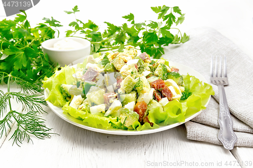 Image of Salad of salmon and avocado on light board