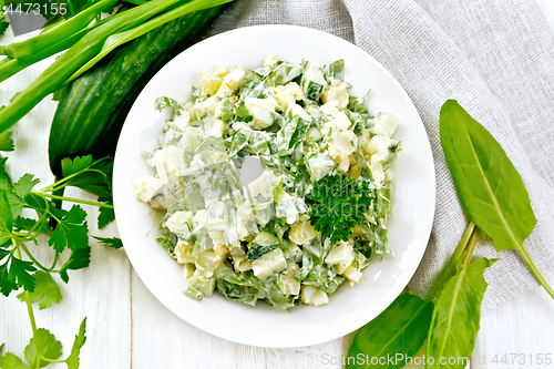 Image of Salad with potatoes and sorrel on light board top