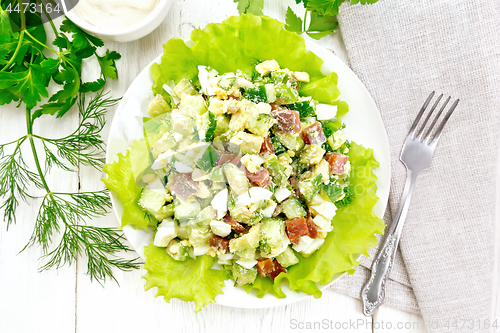 Image of Salad of salmon and avocado on board top