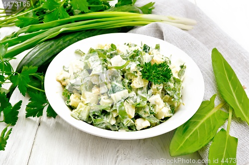 Image of Salad with potatoes and sorrel on wooden table