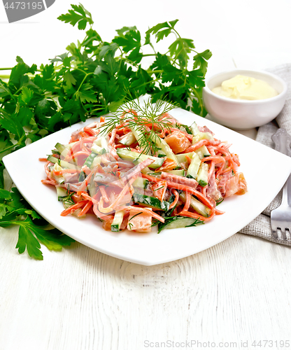 Image of Salad of sausage and spicy carrots with mayonnaise on table