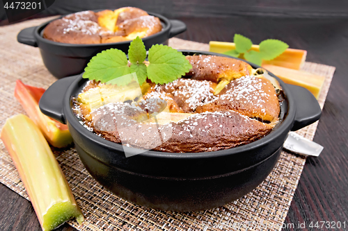 Image of Klafuti with rhubarb and mint in brazier on wooden board