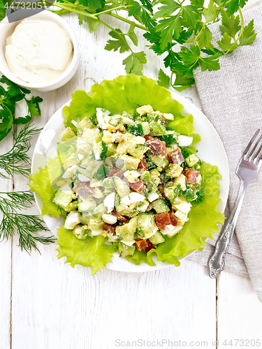 Image of Salad of salmon and avocado on light board top