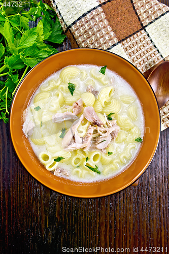 Image of Soup creamy of chicken and pasta in plate on dark board top