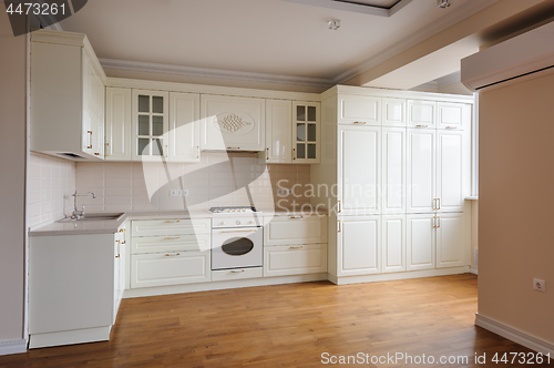 Image of Classic cream colored kitchen