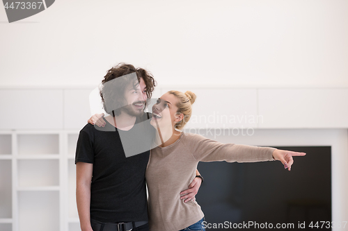 Image of couple hugging in their new home