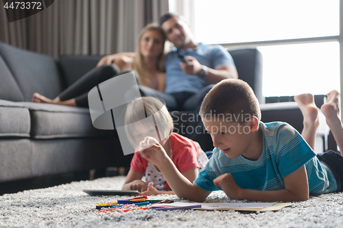 Image of young couple spending time with kids