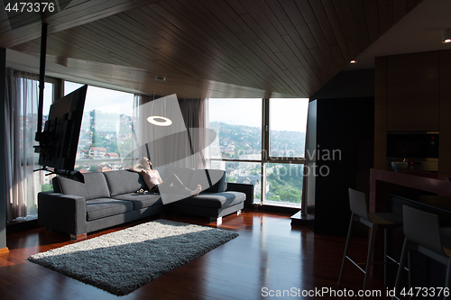 Image of woman using tablet in beautiful apartment