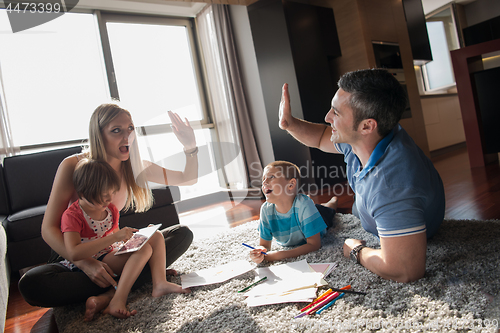 Image of young couple spending time with kids