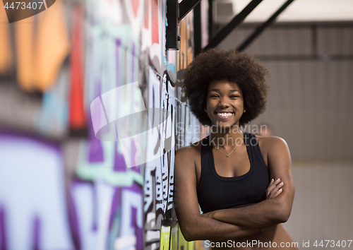 Image of black woman after a workout at the gym