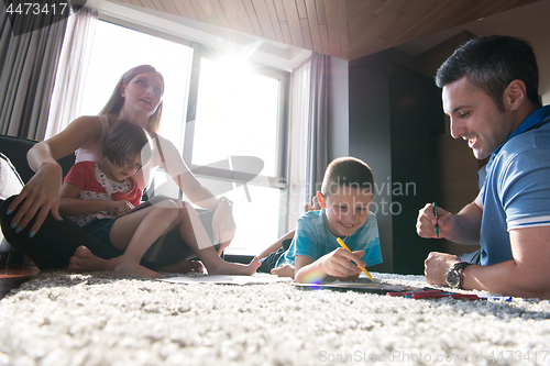 Image of young couple spending time with kids