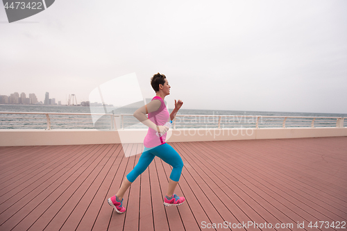 Image of woman running on the promenade