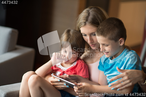 Image of Young Family Using A Tablet To Make Future Plans