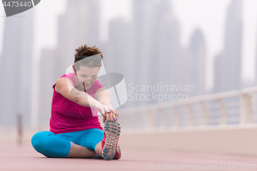 Image of woman stretching and warming up