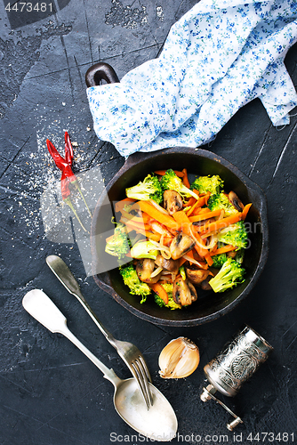 Image of fried mushrooms with vegetables