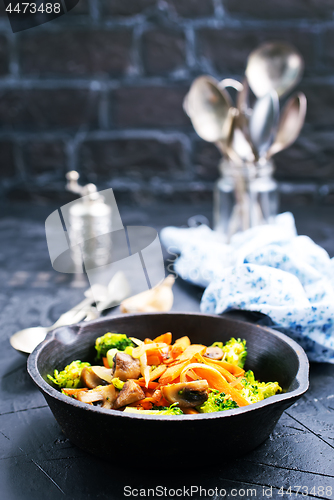 Image of fried mushrooms with vegetables