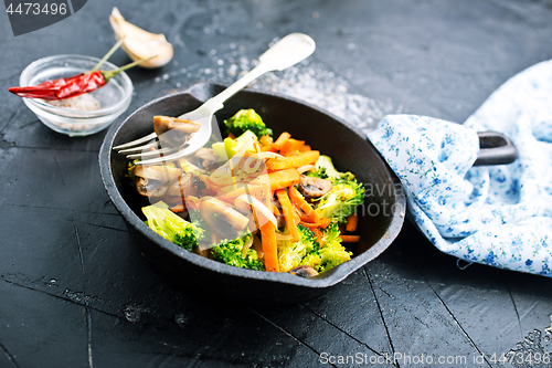 Image of fried mushrooms with vegetables