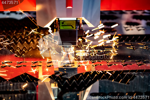 Image of CNC Laser cutting of metal, modern industrial technology.