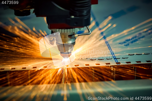 Image of CNC Laser cutting of metal, modern industrial technology.