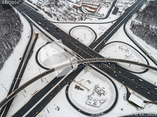 Image of Aerial view of a freeway intersection Snow-covered in winter.