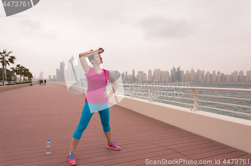 Image of woman stretching and warming up