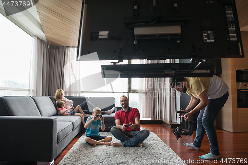 Image of Happy family playing a video game