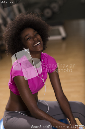 Image of woman  relaxing after pilates workout