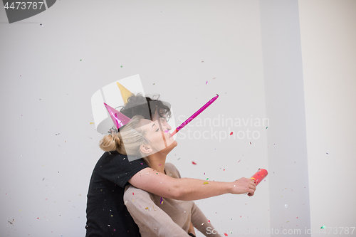 Image of romantic young  couple celebrating  party with confetti