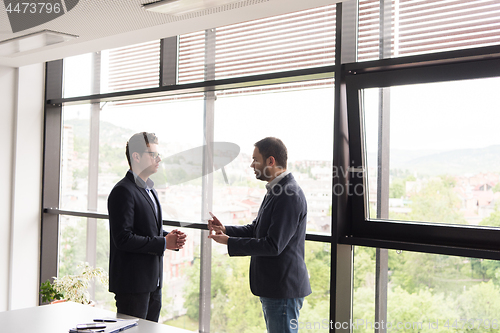 Image of cloasing the deal in modern office interior