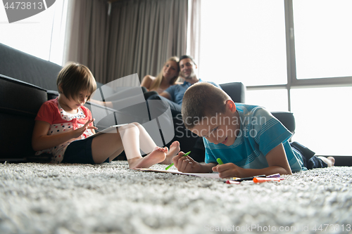 Image of young couple spending time with kids