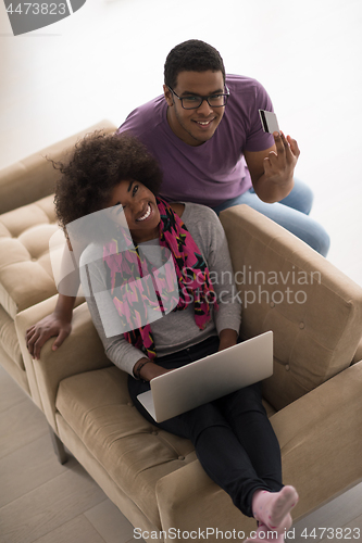 Image of african american couple shopping online