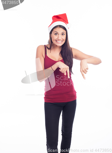 Image of Happy christmas woman pointing