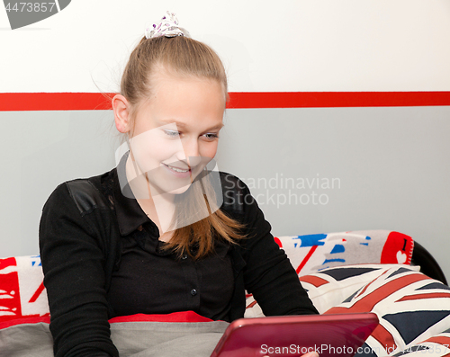Image of girl with a digital tablet