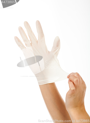 Image of put a latex glove